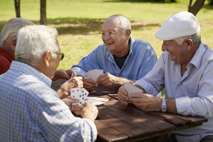 Guys playing chess talking about medicare